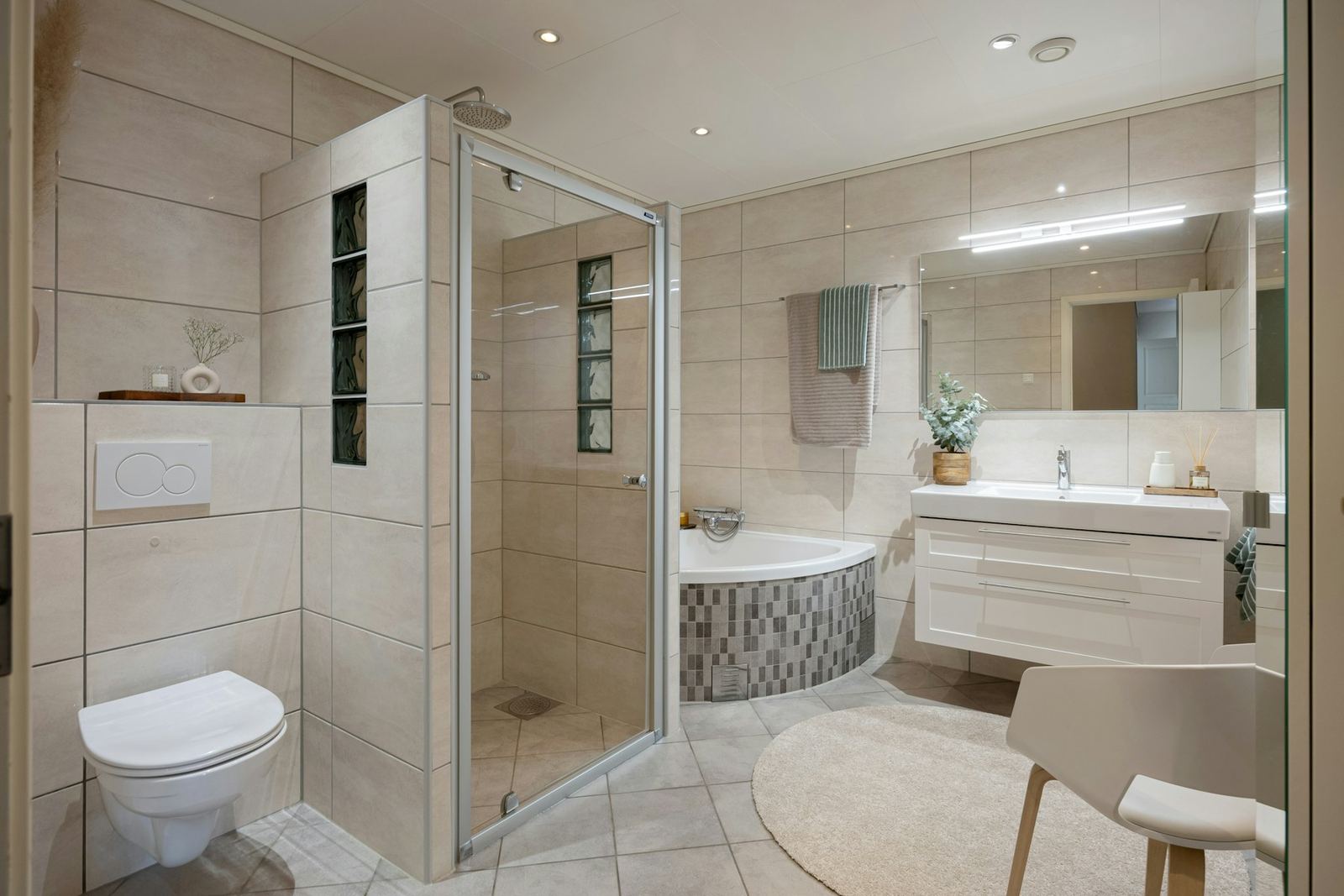Large bathroom with a tiled walk-in shower, a corner tub and a floating double vanity